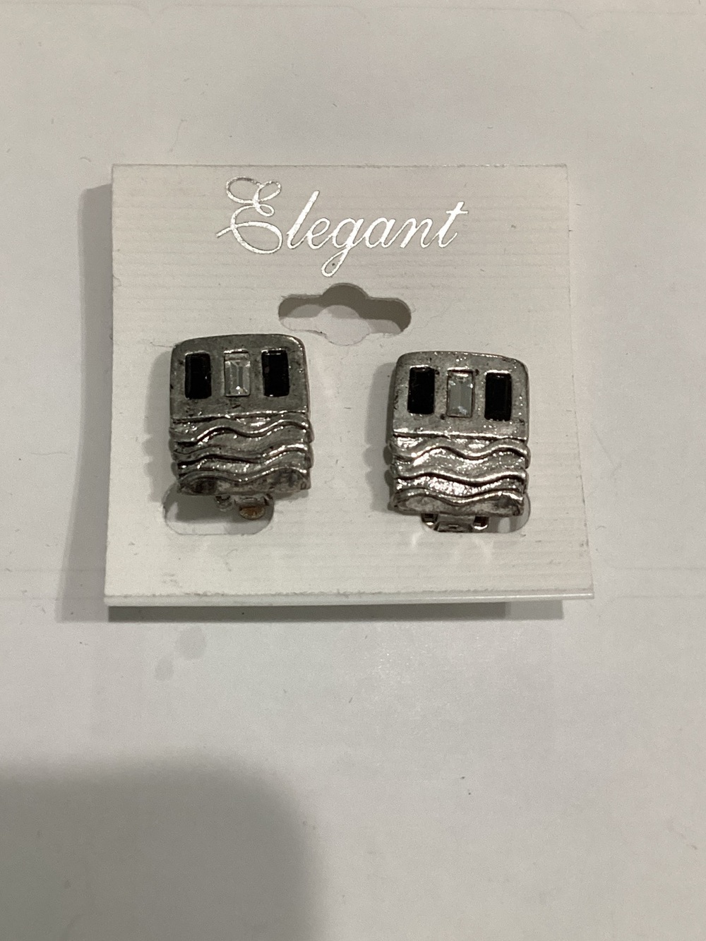 Silver-Tone Wave Clip-On Earringsβ with Black Accents